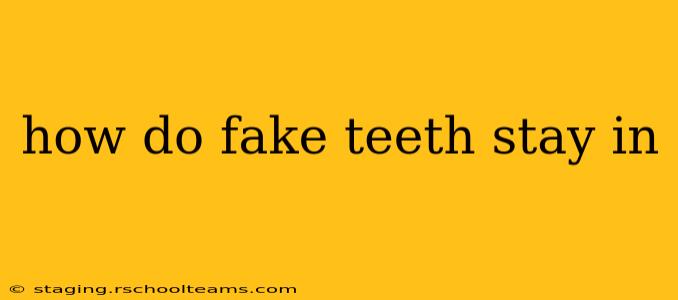 how do fake teeth stay in