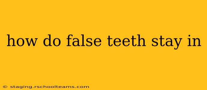 how do false teeth stay in