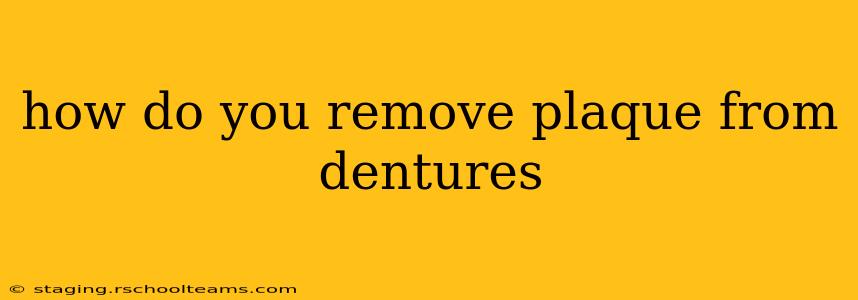 how do you remove plaque from dentures
