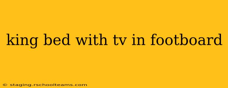 king bed with tv in footboard