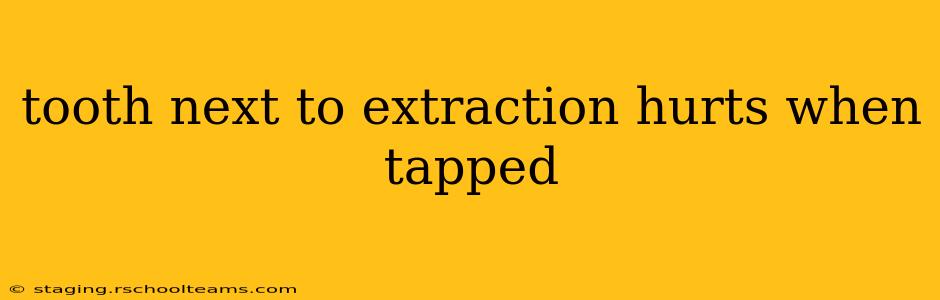 tooth next to extraction hurts when tapped