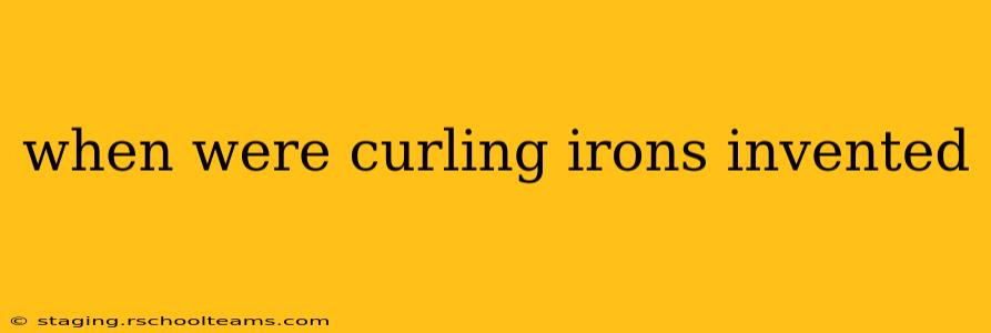 when were curling irons invented
